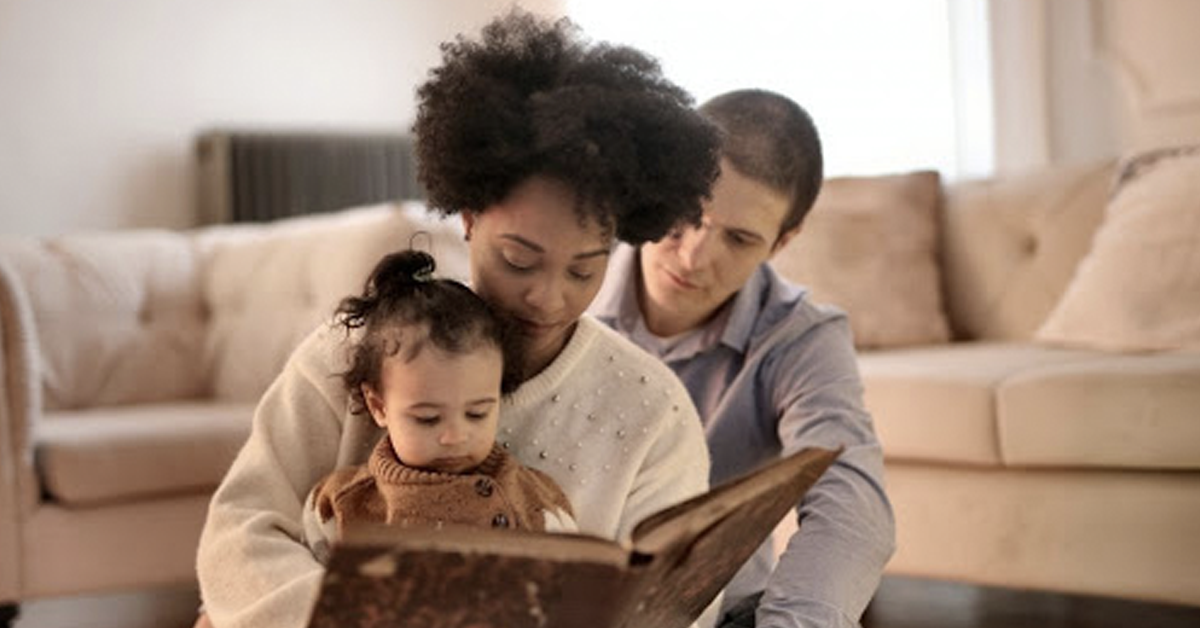 family-with-young-child-reading-together