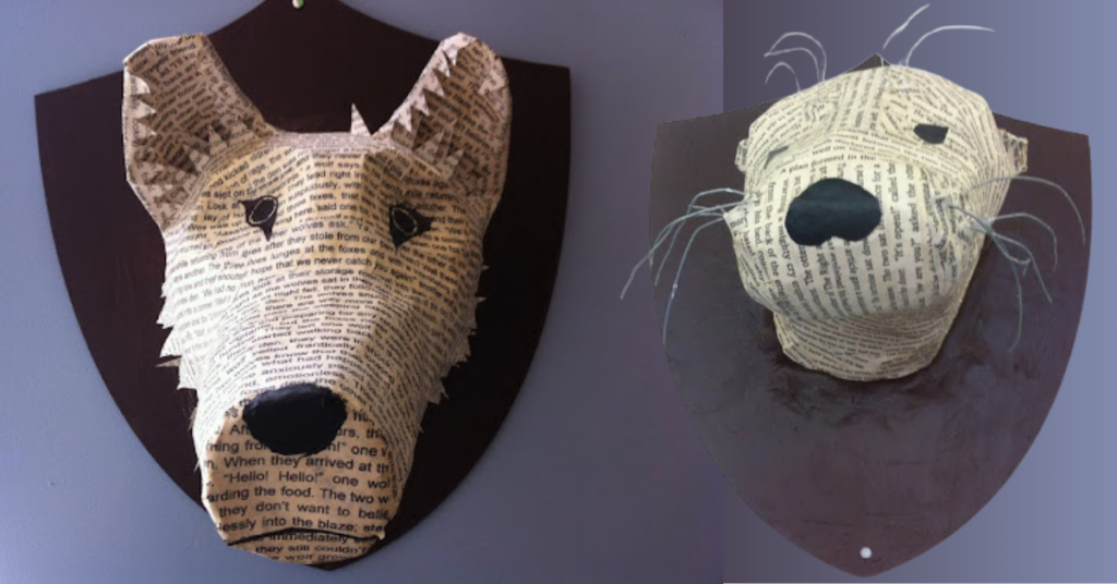 Close-up of two Animalia busts made by learners.